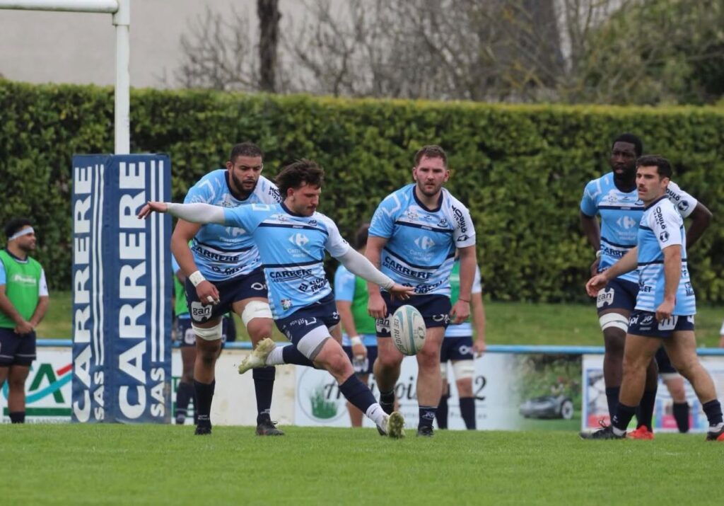 Axel Ducellier, Fleurance full-back, clears with his boot during a Nationale 2 match