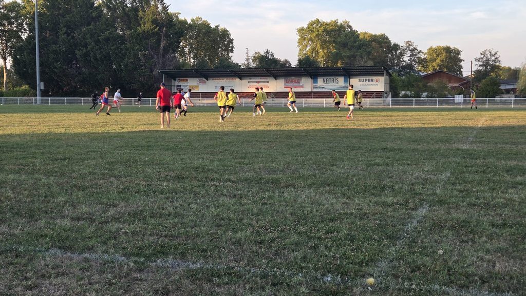 Lombez-Samatan players training in front of the stand at the ground
