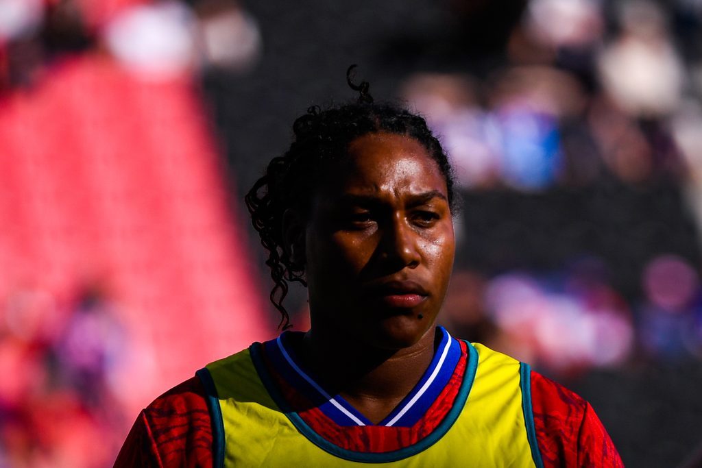 Portrait of Cloé Correa wearing a yellow bib over her France jersey